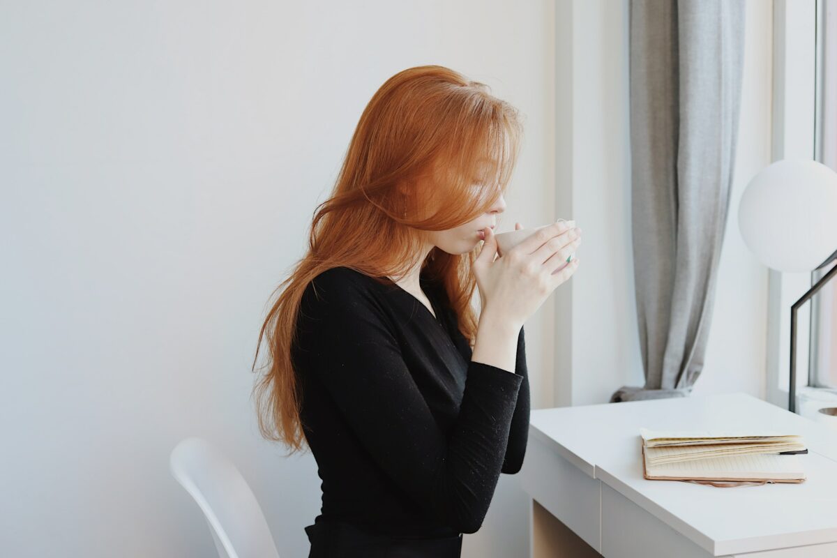 woman in black long sleeve shirt sitting on chair