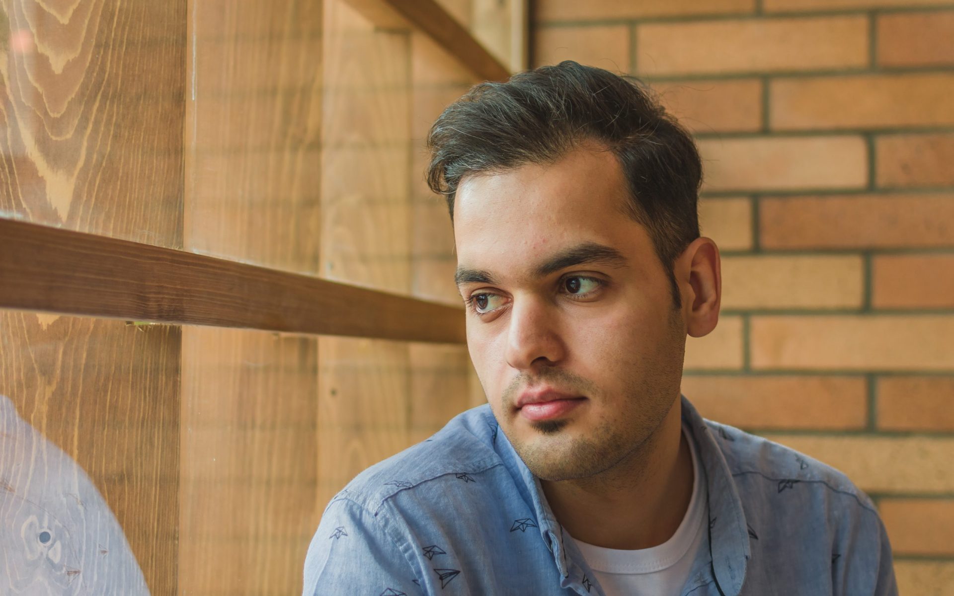 man wearing blue dress shirt